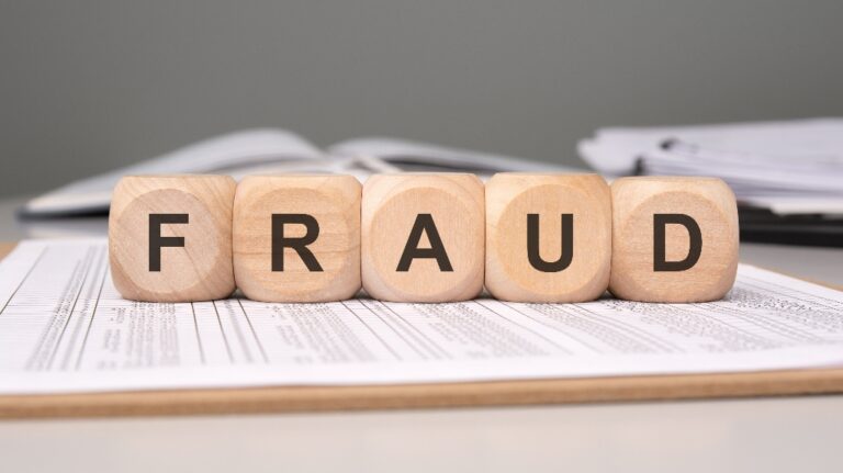 Wooden blocks with word Fraud