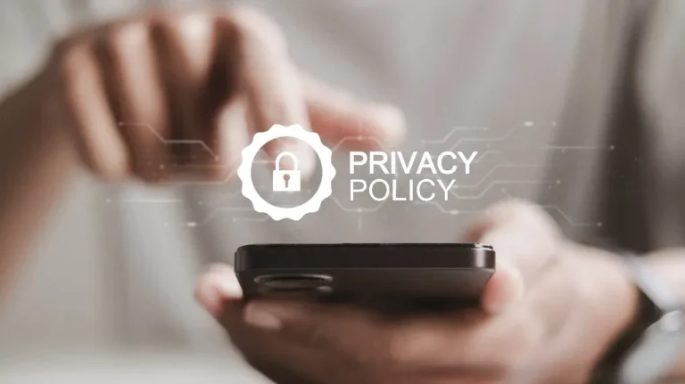 Close-up of a person holding a smartphone with a digital "Privacy Policy" lock icon overlay.