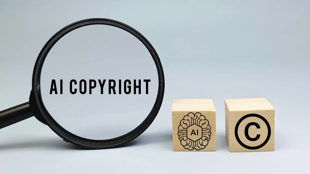 Magnifying glass focusing on the text "AI COPYRIGHT" with wooden blocks displaying AI and copyright symbols.